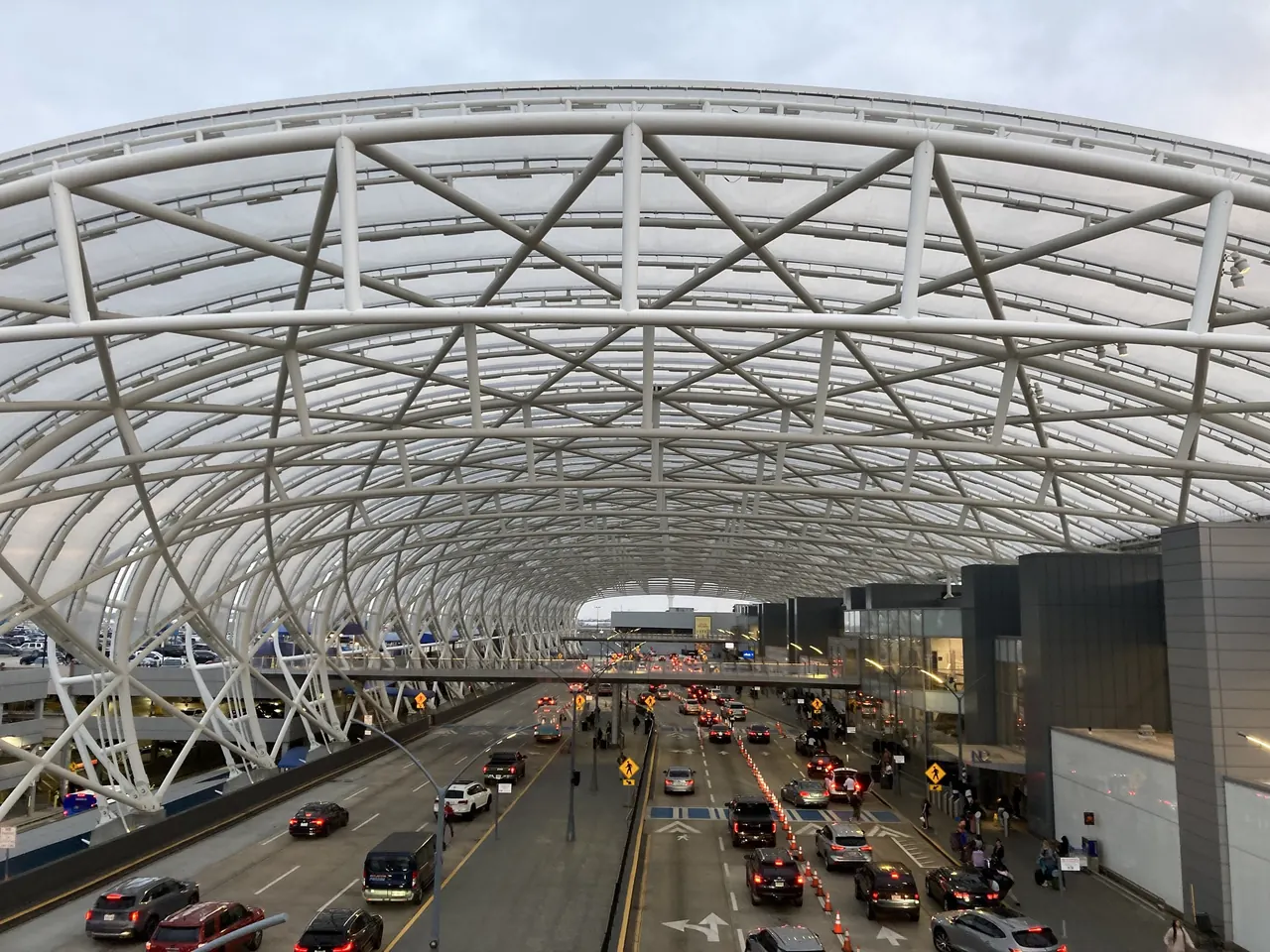 Curved white canopy over the domestic terminal departures roadway at Atlanta airport