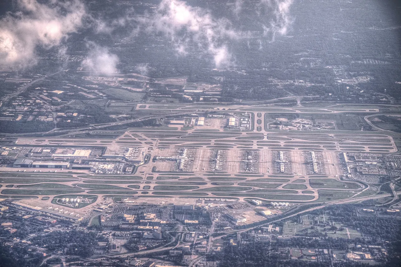 Aerial view of Hartsfield-Jackson Atlanta International Airport showing the parallel runways and the concourses between them